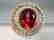 Ring with red Topaze faceted