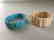 a set of turquoise/bone bracelace