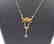 18 carat yellow gold necklace with diamon and ruby