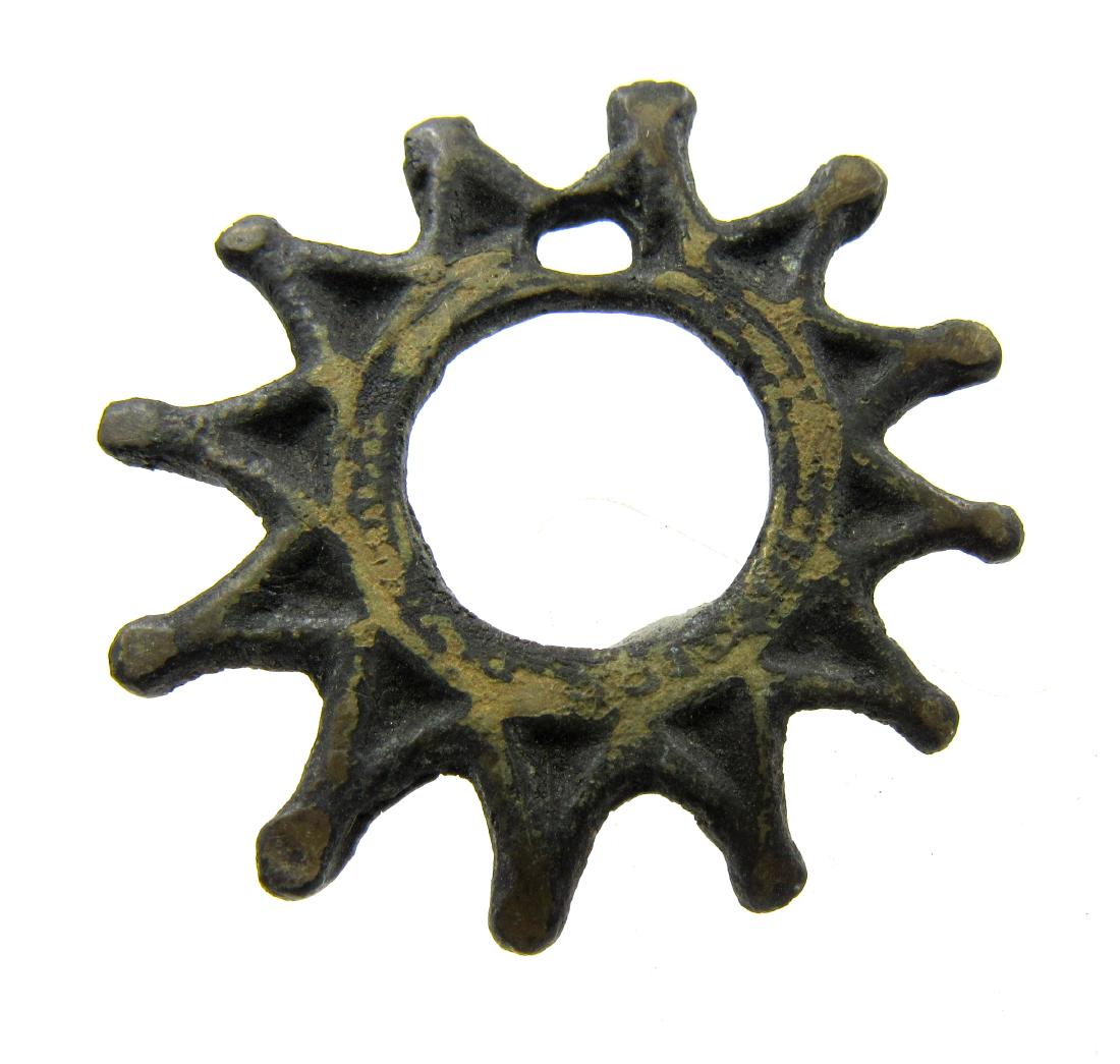 Medieval Viking Era Bronze Sun Amulet: Medieval Viking Era Bronze Sun Amulet Date: Circa 900 – 1100 AD Medieval Viking Era Bronze Sun Amulet. Professionally cleaned and polished to show original details. This item includes a free gift ba