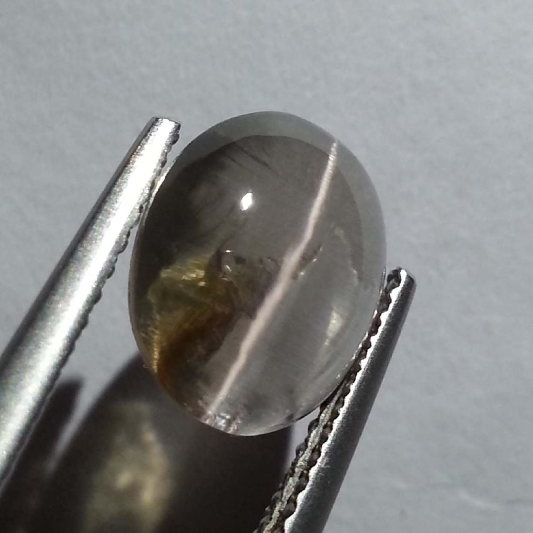 Sillimanite Cat's Eye - 3.76 ct: Sillimanite Cat's Eye - 3.76 ct Color/Clarity: Opaque Carat Weight: 3.76 Size: 10.00 x 8.90 x 4.80 Oval - Africa No Reserve: This lot starts at $1 and has no reserve as a courtesy so that collectors c
