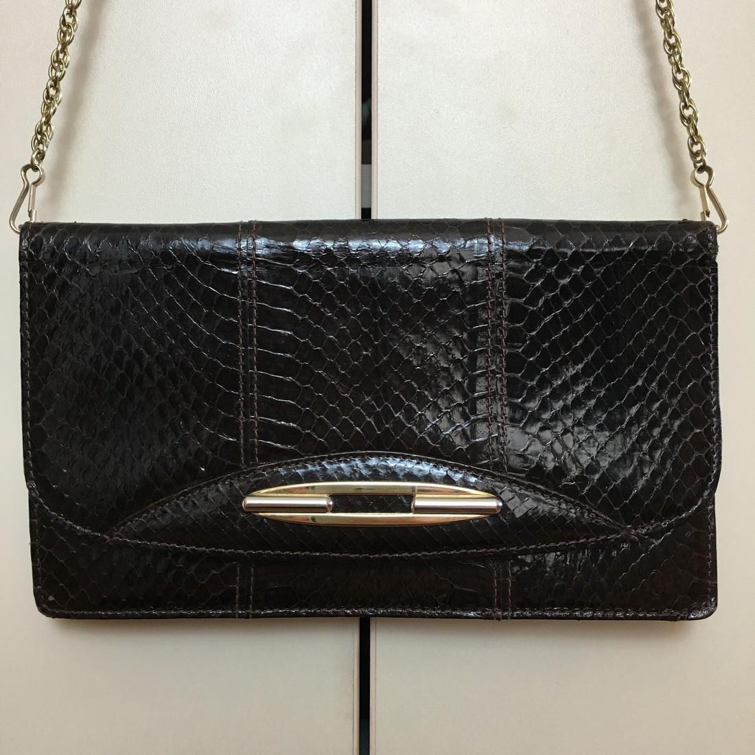 Vintage Real Snake Skin Leather Clutch Bag: Vintage Real Snake Skin Leather Clutch Bag Period: Vintage Materials: Snake Skin Leather Size: Measurements: 23 cm wide 13 cm tall Please note that this lot has a confidential reserve. When you leave