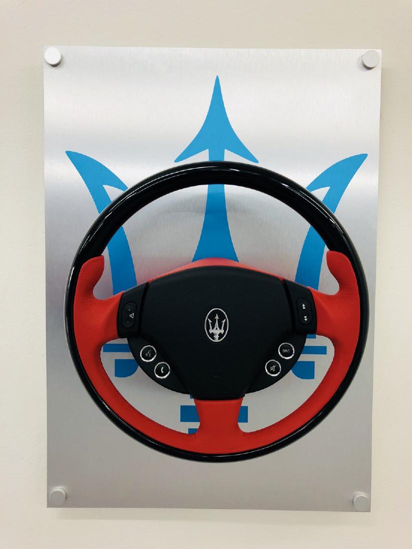 Aluminium Panel with Real Maserati Steering Wheel: Large Panel with the Halmo interpretation of a Maserati Steering Wheel, printed on an aluminium panel of 50x70 cm, 3 mm thick. We included an original Maserati Steering wheel to have a unique and comp