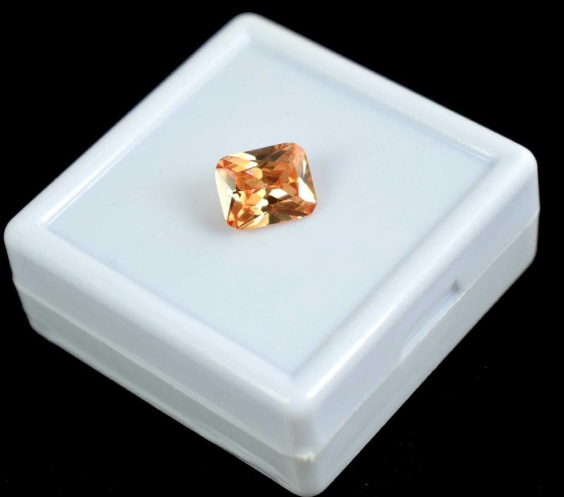 5.50 Ct Natural Champagne Zircon IGL Certified: Item: 5.50 Ct Natural Champagne Zircon IGL Certified Additional Information: Total Carat Weight (TCW): 5.50 Depth: 4mm Length: 10 mm Width: 8mm Certificate: IGL Country of Origin: Cambodia Shape: Emer