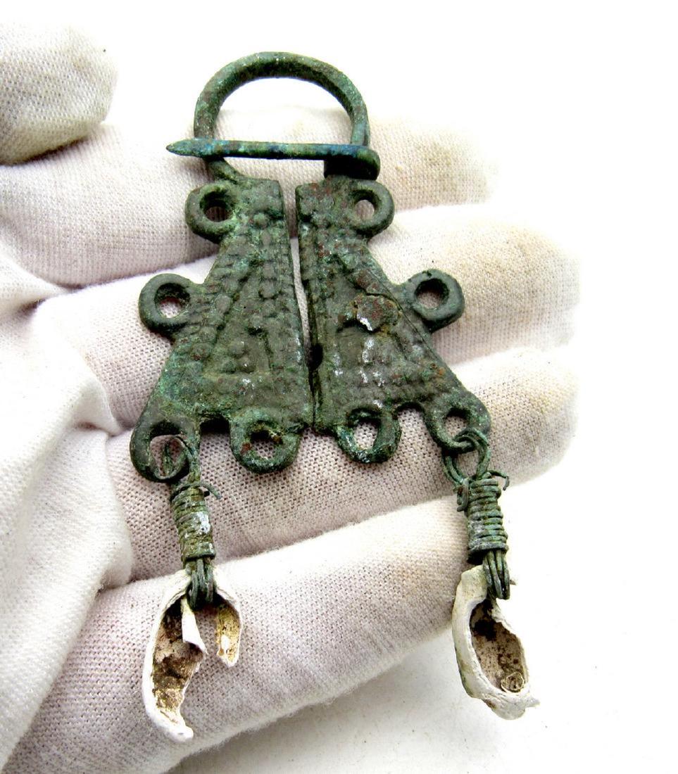 Medieval Viking Era Bronze Omega Penannular Brooch with: Medieval Viking Era Bronze Omega Penannular Brooch with Date: C. 900 - 1100 A.D. Medieval Viking Era Bronze Omega Penannular Brooch with Shells Material: Bronze Provenance: Obtained from an old Britis