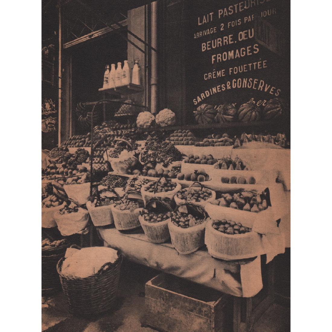EUGENE ATGET - L'Étalage du Fruitier: Artist: EUGENE ATGET Print Title: L'Étalage du Fruitier Medium: Sheet-Fed Gravure Printed in 1945 Printed in France Image Size: 6.25 x 8 inches Jean-Eugène-Auguste Atget (1857-1927) was a pioneer of