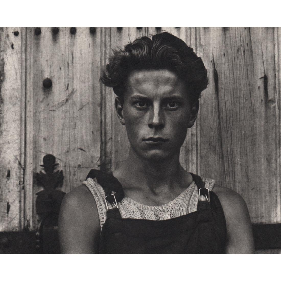 PAUL STRAND - Jeune Gars: Artist: PAUL STRAND Print Title: Jeune Gars, Gondeville, France Medium: Sheet-Fed Gravure Printing Date: 1952 Printed in Switzerland Image Size approx: 6 X 5 inches Paul Strand (1890–1976) was an Am