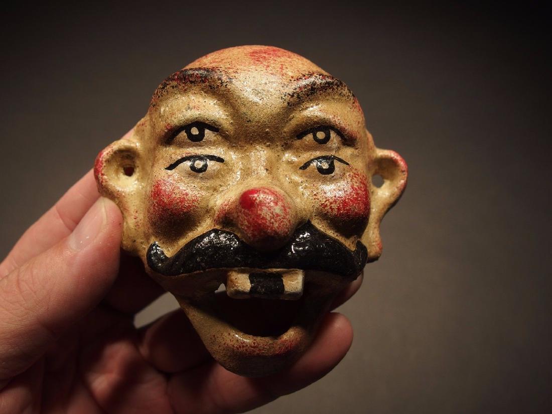 Cast Iron folk art 4 eyed Beer Clown Wall Bottle Opener: Antique Vintage Style Cast Iron wall mount folk artl Beer Bottle Opener Description 3 5/8" Tall x 3 1/2" Wide Great reproduction cast iron bottle opener. This piece was made to look just like an antiq