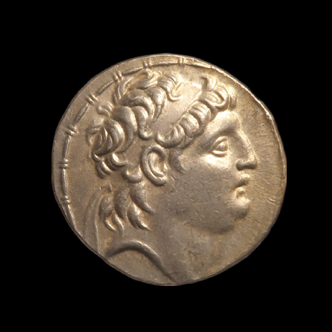 Greek Silver Tetradrachm, Seleukid Kingdom. King: Greek Silver Tetradrachm, Seleukid Kingdom. King Antiochus VII, Euergetes, 138-129 B.C. Greek, 138-129 B.C. Silver, 16.4 grms 2.9 cm D - 1 3/16 inches Provenance: Acquired on the London art market in