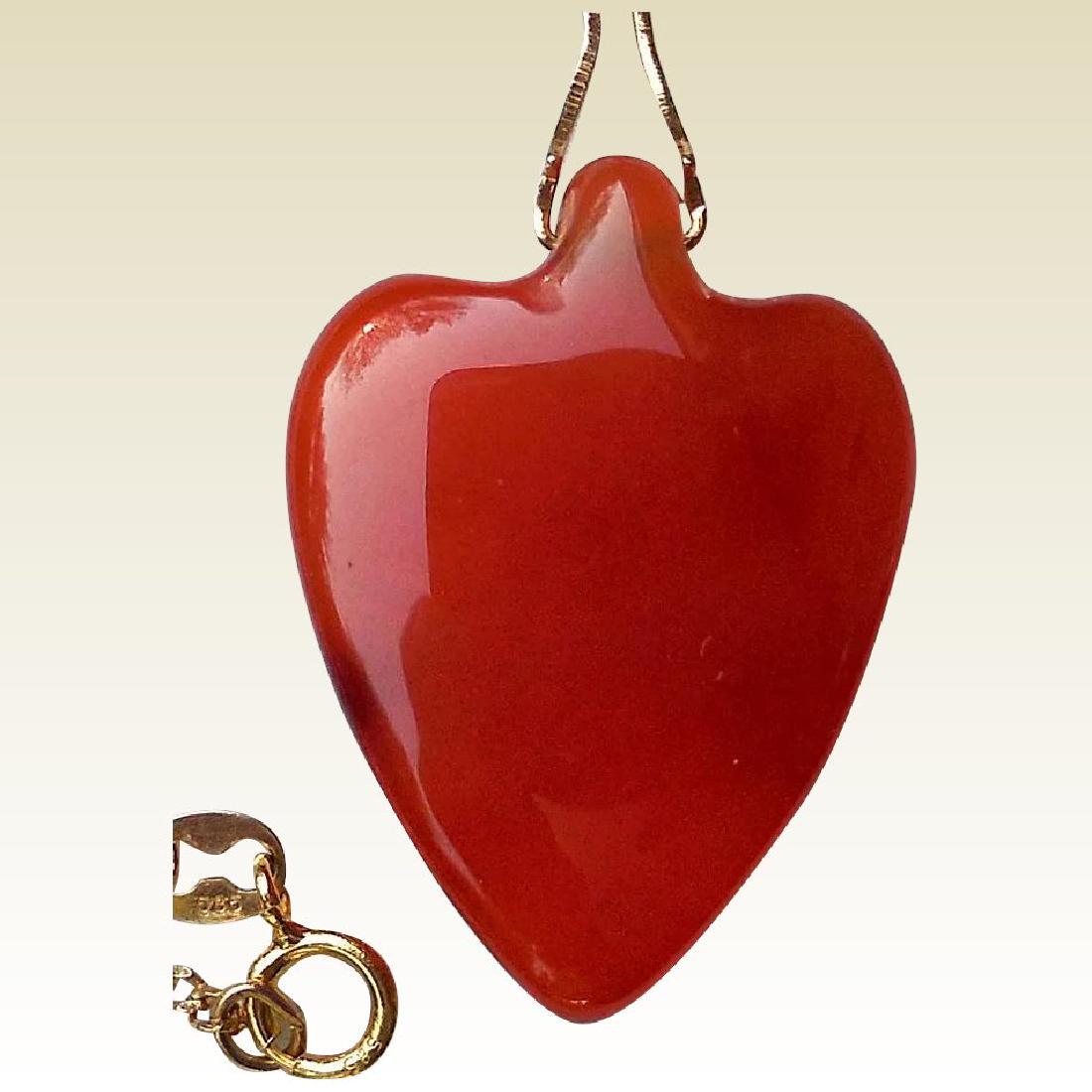 Carnelian Heart Pendant, 14K Gold: Title: Carnelian Heart Pendant, 14K Gold Maker: Unknown Origin: Unknown Date/Period: Ca 1970s/80s Materials: Natural Carnelian, 14K Yellow Gold Size: Pendant: 1 inch long, Chain: 20 inches long This r