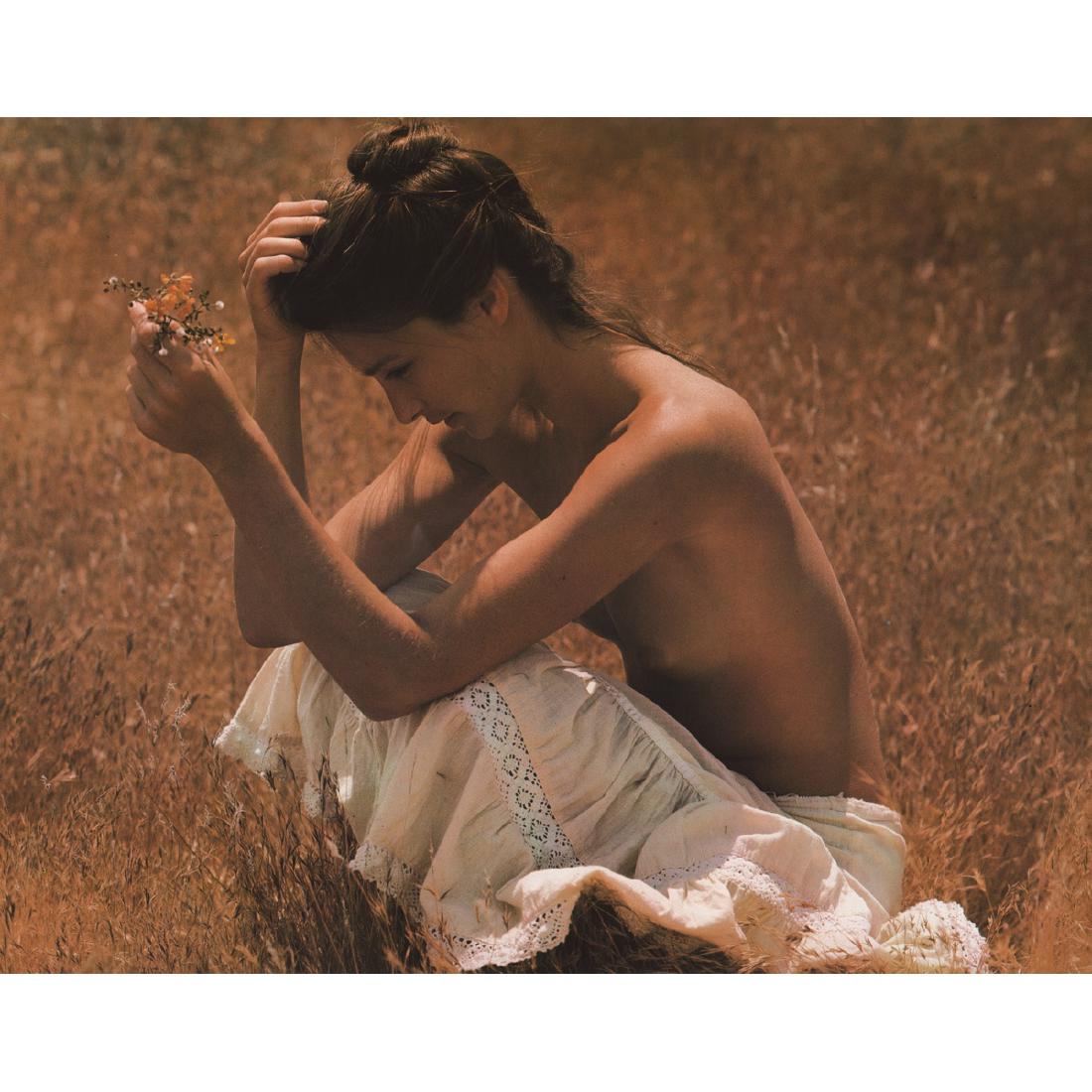 SAM HASKINS - Woman in the Field: Artist: SAM HASKINS Print Title: Woman in the Field Medium: Color Photo-Lithograph Printing Date: 1980's Printed in Japan Image Size approx: 14 X 11 inches Sam Haskins (1926-2009) was a British photog