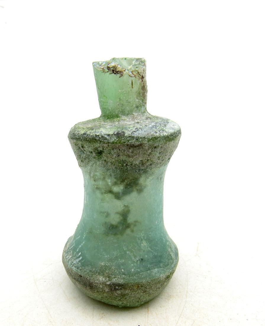 Ancient Roman Glass Flask: Ancient Roman Glass Flask Date: C. 100 - 300 A.D. Material: glass Size: 60x32mm; 29grams Hand-blown glass with nice irridescence. Obtained from an old British collection, purchased from a private coll