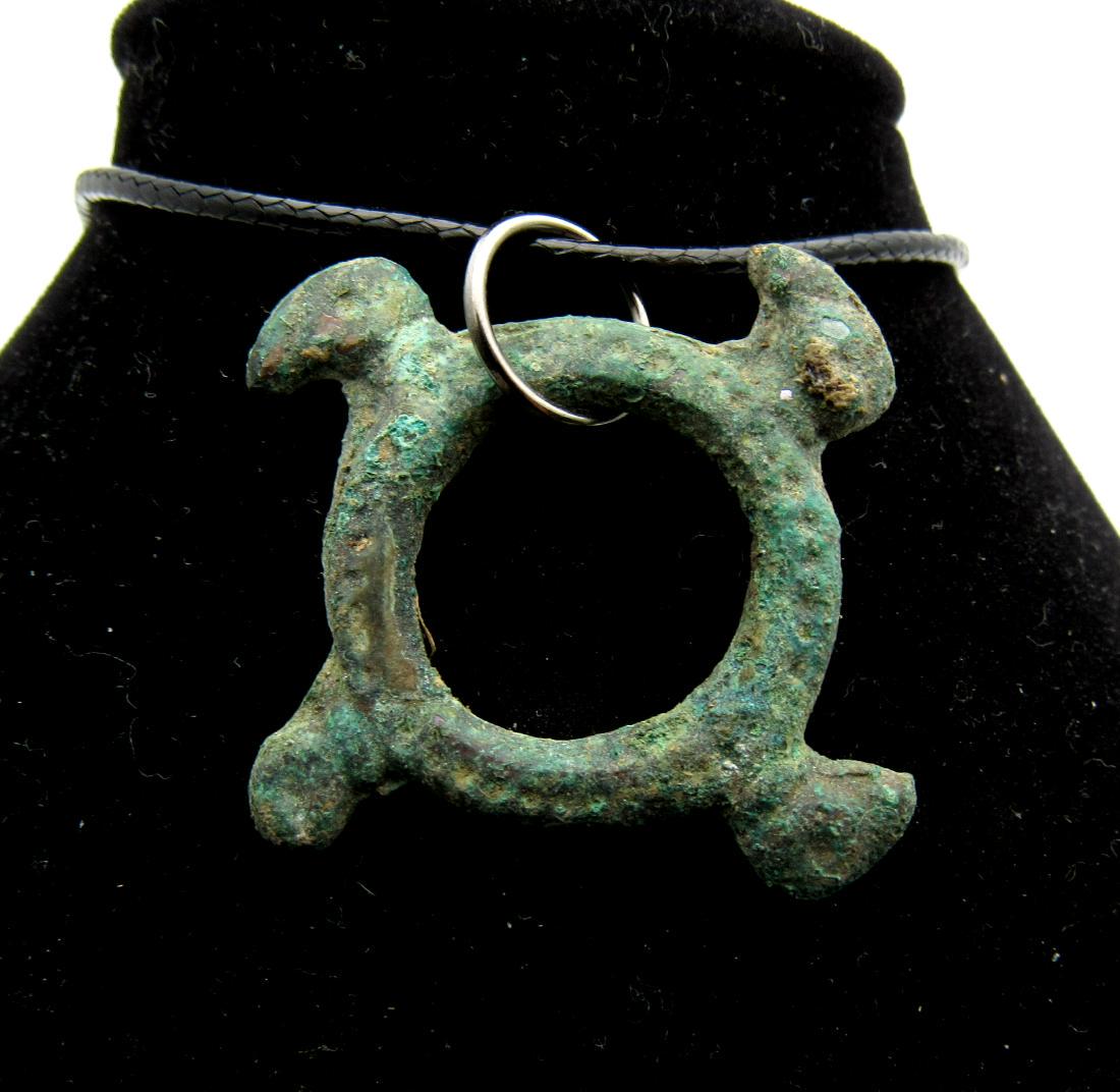 Viking Bronze Eagle Headed Swastika Pendant: Viking Bronze Eagle Headed Swastika Pendant Date: ca. 900 AD Material: bronze Size: 36mm; 5.7grams Rare Viking Scandinavian open-work pendant with 4 eagle heads forming a swastika. Superb mythological