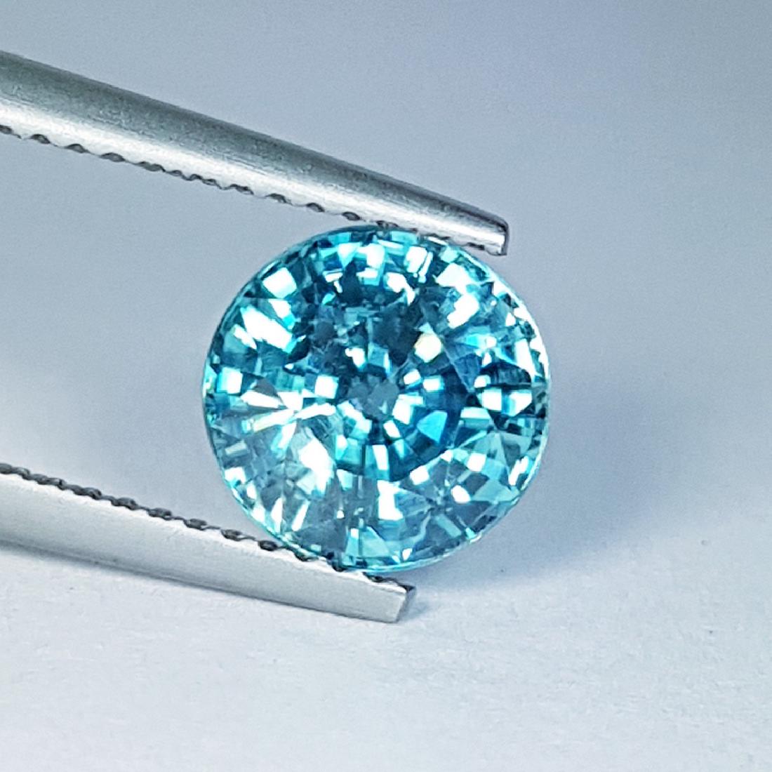IGI CERTIFIED Blue Zircon - 3.12 ct: Item: "IGI CERTIFIED" Blue Zircon - 3.12 ct Loose gemstone Color/Clarity: VVS Carat Weight: 3.12 Size (mm): 7.93 x 8.07 x 5.05 Round - Cambodia No Reserve: This lot starts at $1 and has no reserve as 