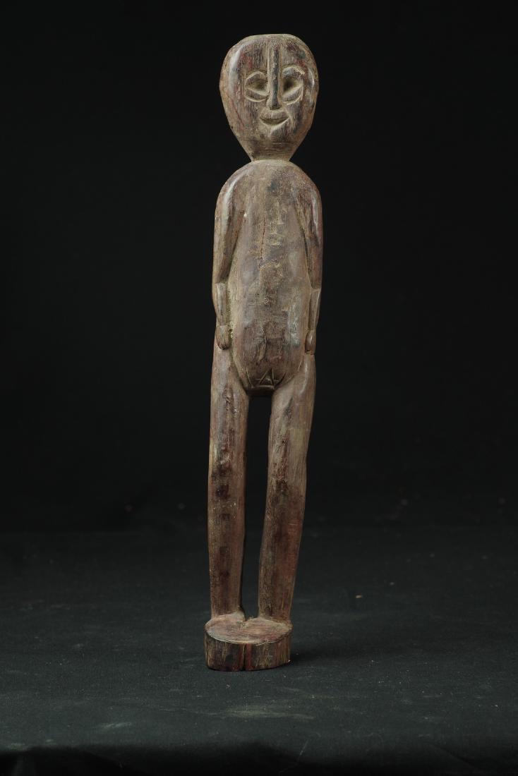 Long and Thin Figure of Female Ancestor: Long and thin figure of female ancestor - Cm 32 (13”) Weight: 330 g Long and thin figure, made of rosewood, depicting female ancestor, standing up with hands along the hips. Collected on the field i