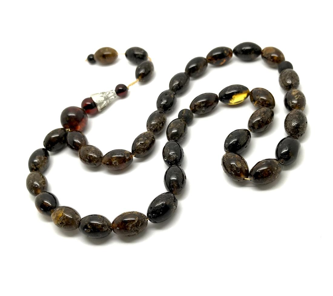 Tesbih Islam rosary Baltic amber beads olives 8x12mm: Item: Tesbih Islam rosary Baltic amber beads olives 8x12mm Metal Purity: melchior Gemstones: Baltic amber Weight: 17.5 grams Size: olive shaped beads 8x12mm Additional Information: collour: dark cogna