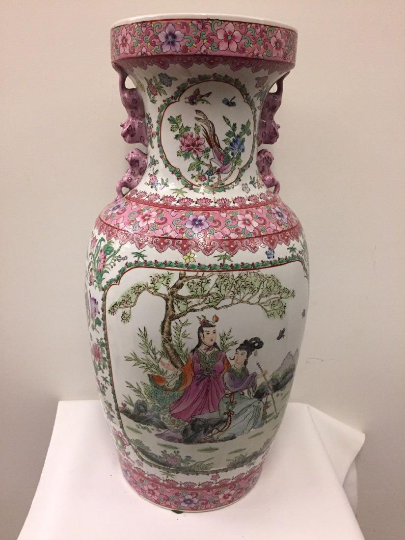 Large Chinese Famille Rose Porcelain Vase: Large Chinese famille rose vase with foo dogs. With overall figural decoration as well as Phoenix birds throughout the vase. Dimensions: Height - 25”, Diameter - 10” Condition: long crack running 