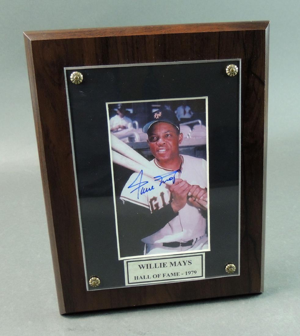 Willie Mays FC Photo Plaque w/ COA: Willie Mays FC Photo Plaque w/ COA. The 9” x 7” full color photo mounted on wood plaque is signed in blue felt tip pen with caption Willie Mays Hall of Fame – 1979. The photo is protected with p