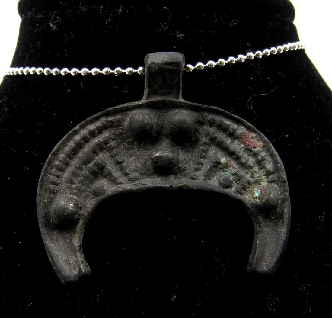 Medieval Viking Era Bronze Lunar Pendant: Medieval Viking Era Bronze Lunar Pendant Date: Circa 900 – 1100 AD Medieval Viking Era Bronze Lunar Pendant. This item has been professionally cleaned to show original details, and includes a lifeti