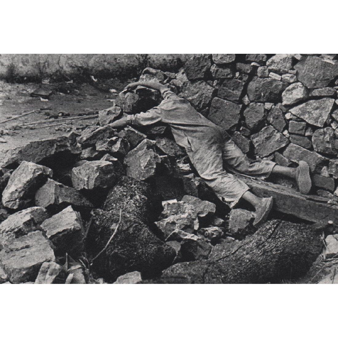 ROBERT CAPA - Dead Child in the Rubble, Spain 1936: Artist: ROBERT CAPA Print Title: Dead Child in the Rubble, Spain 1936 Medium: Sheet-fed Gravure Printing Date: 1960's Printed in Holland Image Size approx: 6.5 x 4.5 inches Robert Capa (1913-1954) was