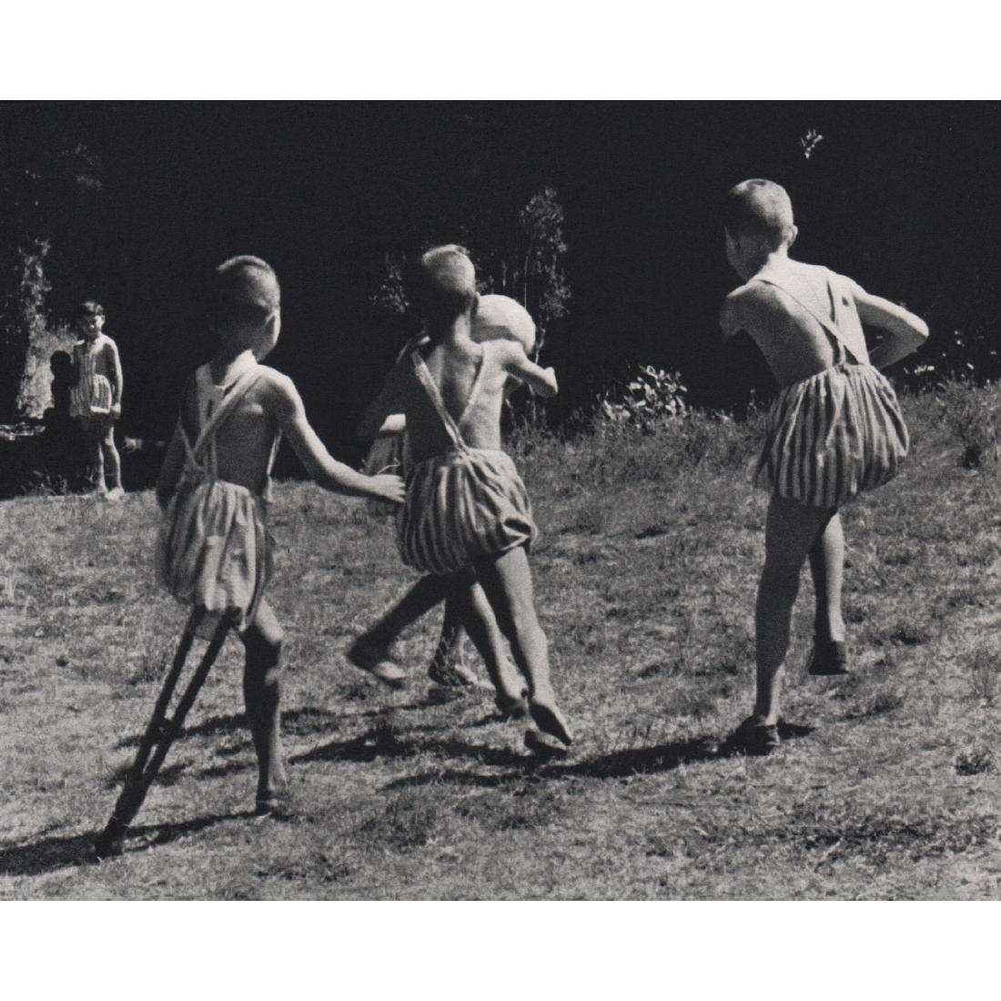 DAVID SEYMOUR - Amputee Children playing soccer: Artist: DAVID SEYMOUR Print Title: Amputee Children playing soccer, Italy 1949 Medium: Sheet-fed Gravure Printing Date: 1960's Printed in Holland Image Size approx: 5.25 X 5.75 inches David Seymour (1
