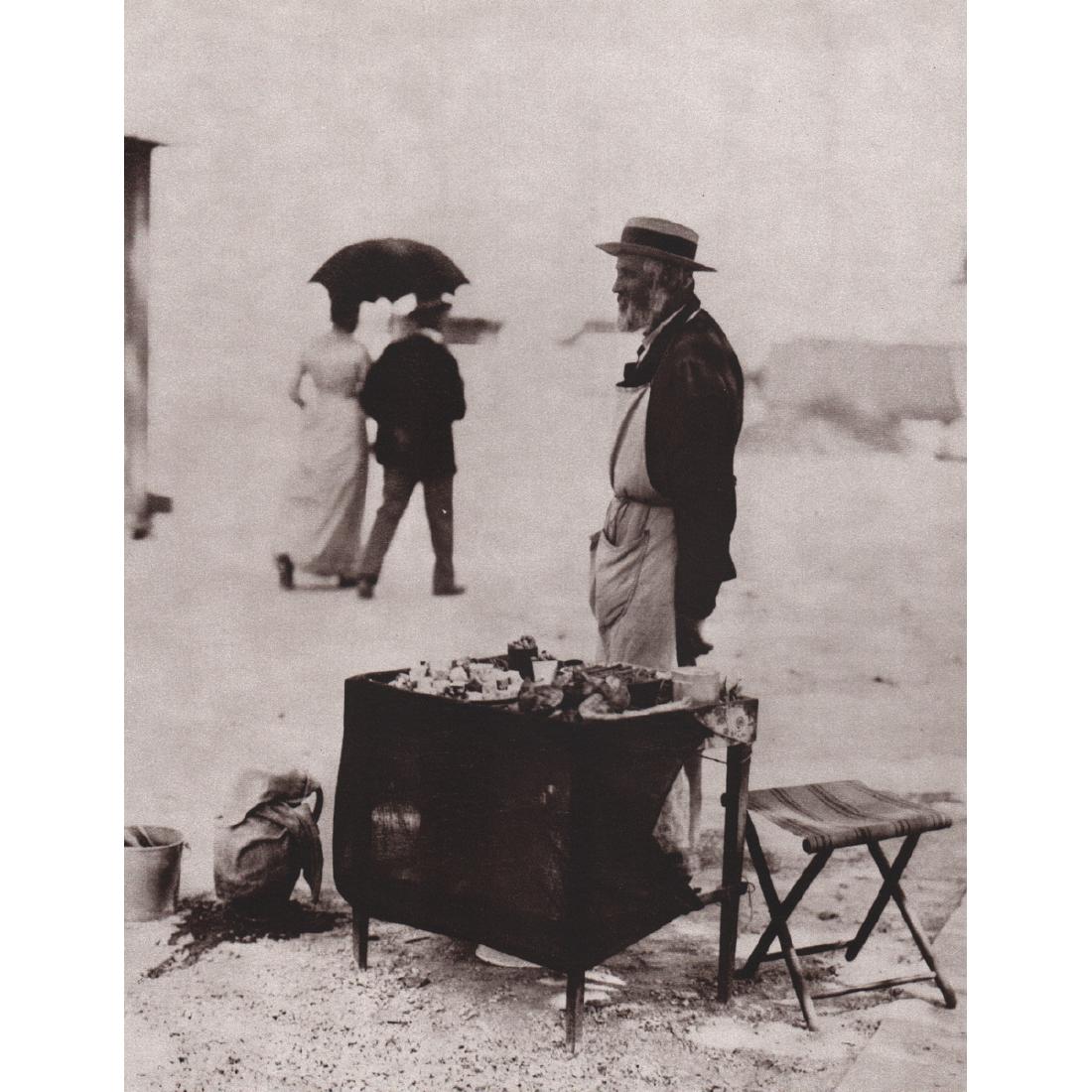 EUGENE ATGET - Marchand de nougats, 1898: Artist: EUGENE ATGET Print Title: Marchand de nougats, 1898 Medium: Sheet-Fed Gravure Printing Date: 1980's Printed in France Image Size approx: 8.5 x 10.75 inches Jean-Eugène-Auguste Atget (1857-192