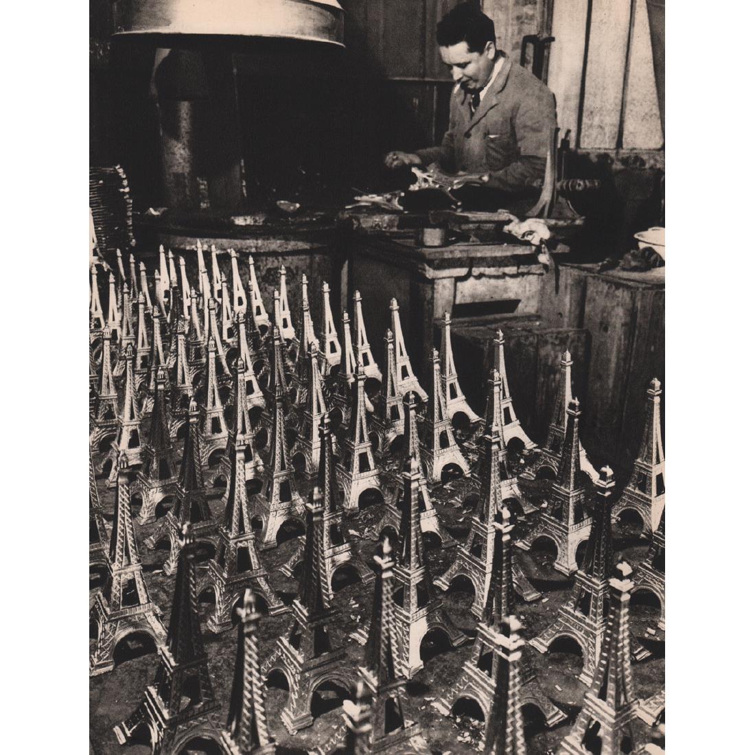 ROBERT DOISNEAU - Eiffel Towers: Artist: ROBERT DOISNEAU Print Title: Eiffel Towers Medium: Sheet-fed Gravure Printing Date: 1950's Printed in France Image Size approx: 8 x 10.5 inches Robert Doisneau (1912-1994) was a French photogr