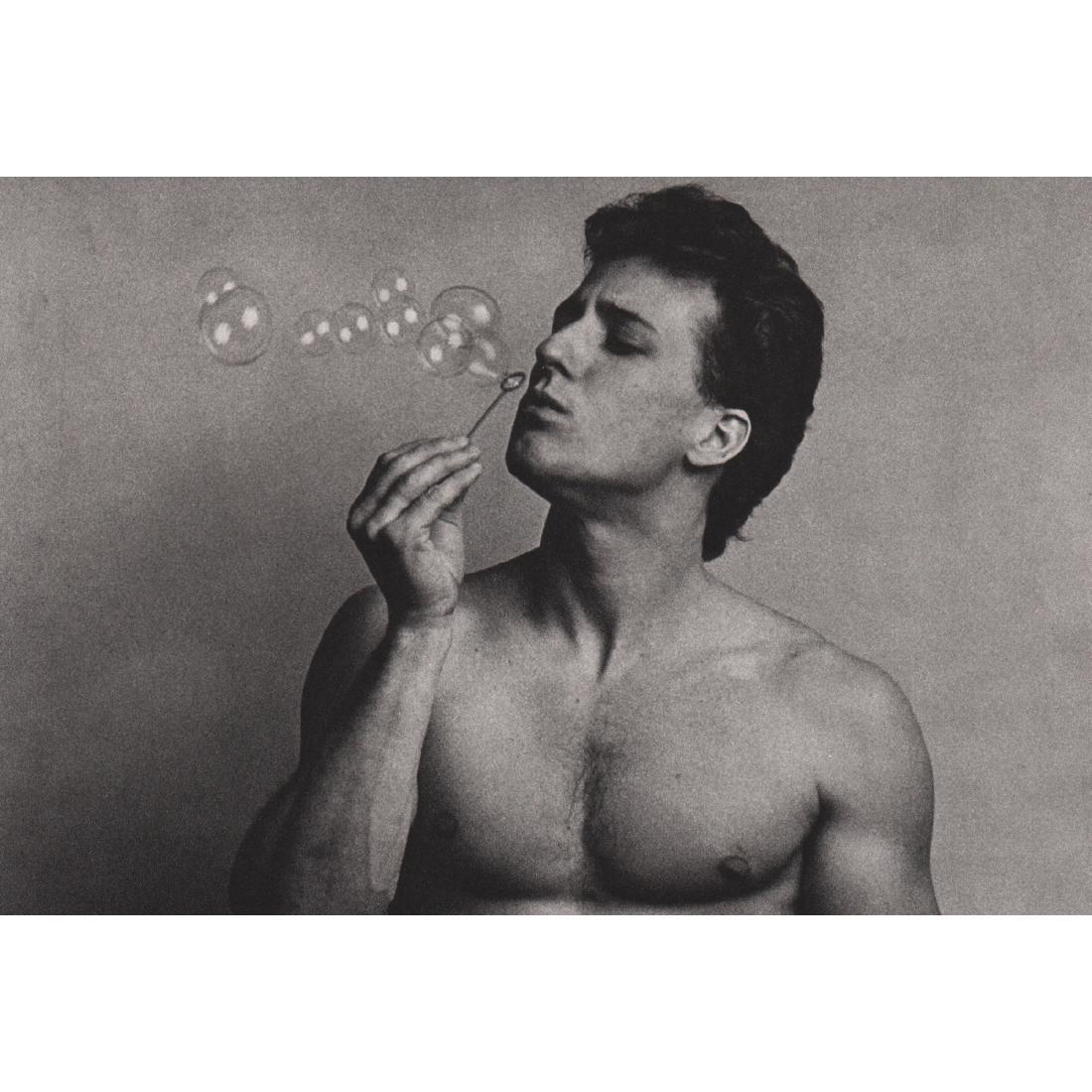 DUANE MICHALS - Blowing Bubbles: Artist: DUANE MICHALS Print Title: Blowing Bubbles Medium: Sheet-fed Gravure on uncoated acid free paper Printing date: 1980's Printed in Japan Image Size approx: 8 X 5.25 inches Duane Michals (b. 193