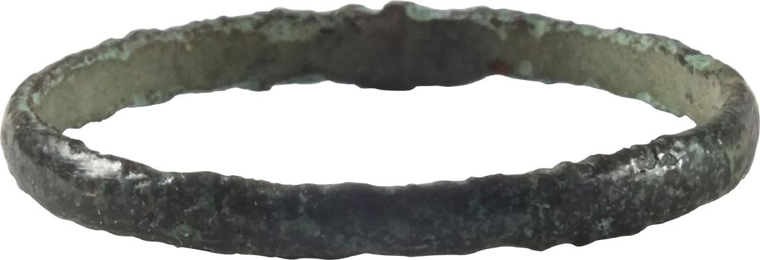 VIKING WEDDING RING, 866-1067 AD: Bronze, size 7 3/4. Narrow band with rounded face. Dark patina with surface slightly textured from burial and mottled in color. Vikings exchanged rings on the pommel of the groom’s sword. No Reserve