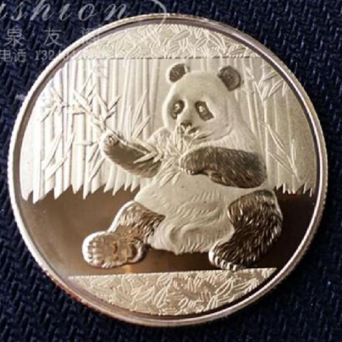 Silver Panda Collectible Coin: Silver Panda Collectible Coin .925 Silver plated collectible coin Diameter: 1.77 in Silver Coin with Panda Bear on one side and temple on the other side Please note that this lot has a confidential re
