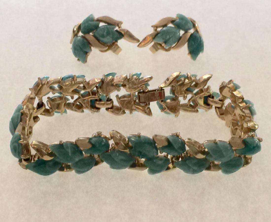 Trifari Goldtone Celadon Fruit Salad Bracelet/Earrings: Trifari Faux jade Fruit Sald Goldtone Bracelet/earring set. Size: approximately 7" long X .35' W Please note that this lot has a confidential reserve. When you leave a bid in advance of the auction, s