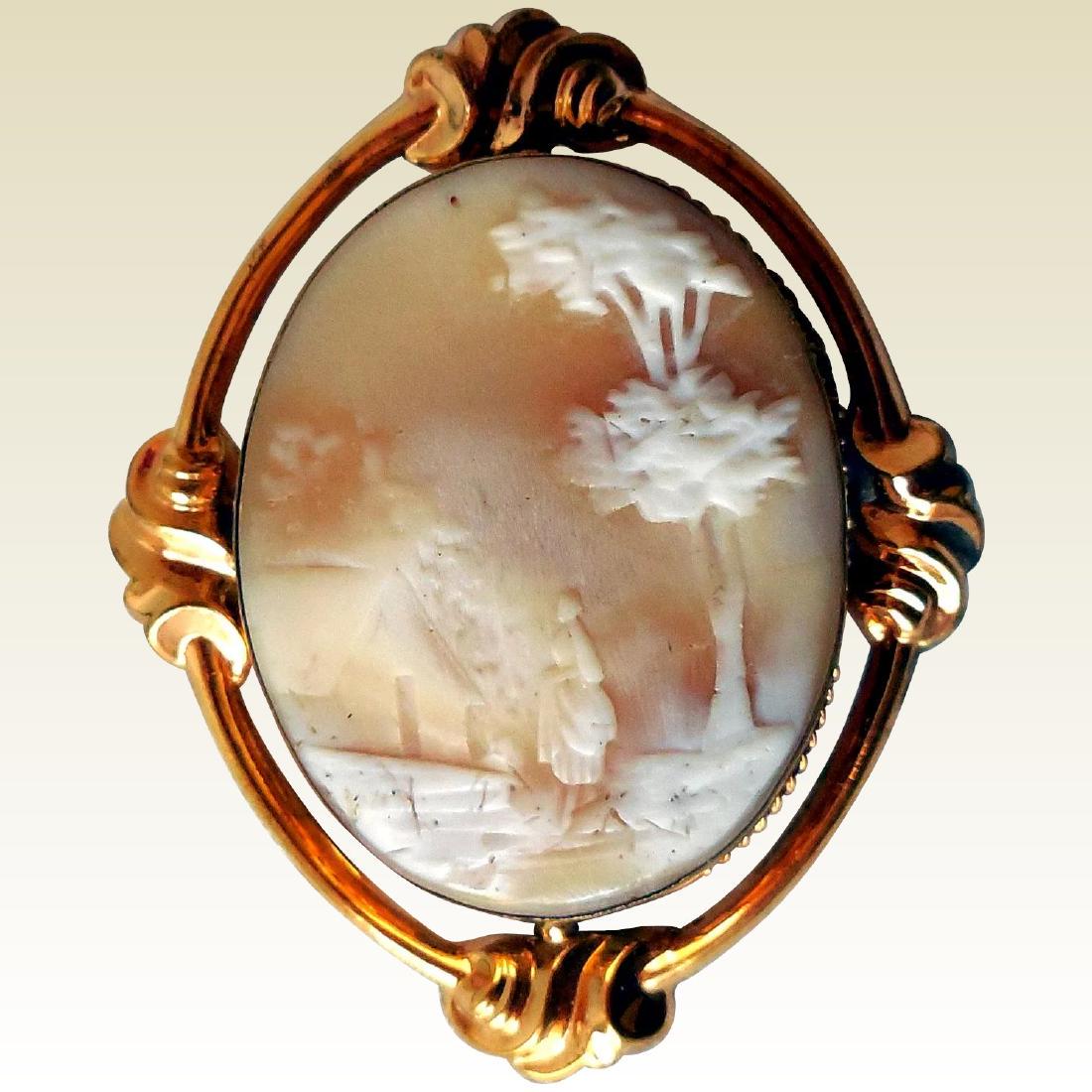 Victorian Carved Shell Cameo, Rebecca at the Well: Item: Victorian Carved Shell Cameo, Rebecca at the Well Maker: Unknown Origin: Unknown Date/Period: Mid-19th Century Materials: Shell, Gold over Brass Size: 2 1/4 inches by 1 3/4 inches This beautiful