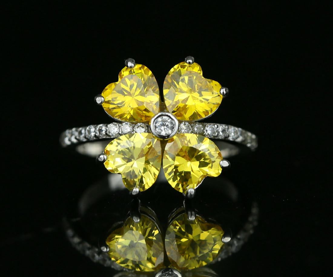 925 silver ring with yellow zirco: Item: 925 silver ring with yellow zirco Metal Purity: 925 Main Gemstones: Zircon Color: Yellow Clarity: Transparent Weight: 3.2g Size/Dimensions: US 7 adjustable Please note that this lot has a confid