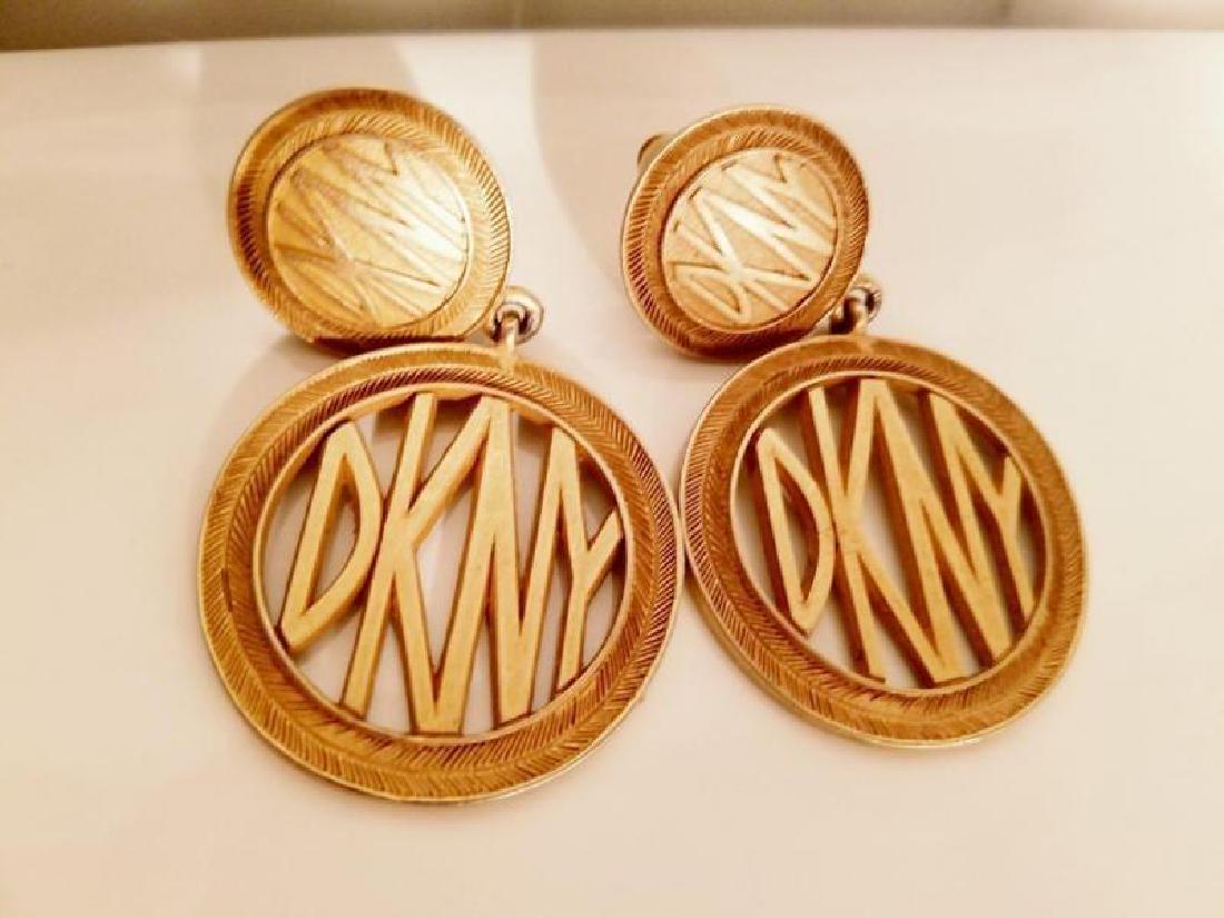 Vtg DKNY gold plated Signature Earrings: DKNY Signature gold plated earrings absolutely stunning in amazing showroom condition. Signed on the back Please note that this lot has a confidential reserve. When you leave a bid in advance of the a