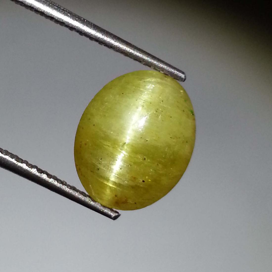 Top Fire Apatite cat's Eye - 3.85 ct: Item: Top Fire Apatite cat's Eye - 3.85 ct Loose gemstone Color/Clarity: Semi -Transparent Carat Weight: 3.85 Size (mm)10.60 x 8.60 x 5.20 Oval - Jharkhand No Reserve: This lot starts at $1 and has no