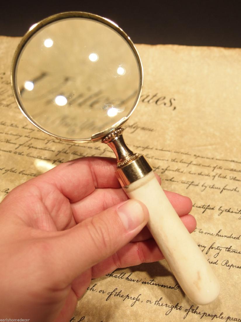 Brass Bone Handle Magnifying glass Desk Magnifier: Antique Style Brass Framed Fur Trade Burning Glass Magnifying 7 1/2" Long x 3" Wide Nice reproduction of an antique! This piece is made just like the early versions with glass, brass, and actual ox or