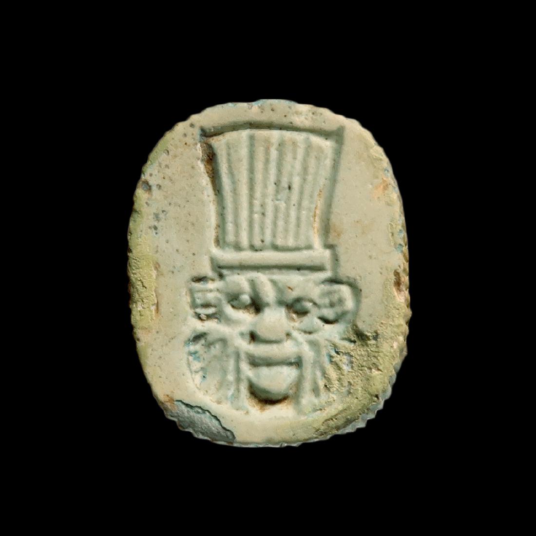 Egyptian Light Blue Faience Plaque, Bes and Eye of: Egyptian Light Blue Faience Plaque, Bes and Eye of Horus, c. 300 B.C. Date & Origin: Egypt, c. 300 B.C. One side engraved in high relief with the Eye of Horus, the other side with the face of bearded