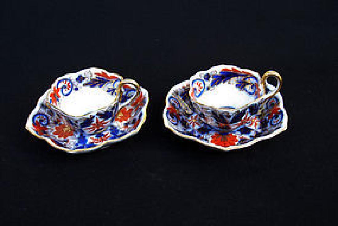 Fischer & Mieg / Pirkenhammer, Prague, cups & saucers: Title: Fischer & Mieg / Pirkenhammer, Prague, cups & saucers Origin: Eastern Europe A pair of small porcelain cups and saucers of lobed shape, decoration of flowers in the English style in Imari colou