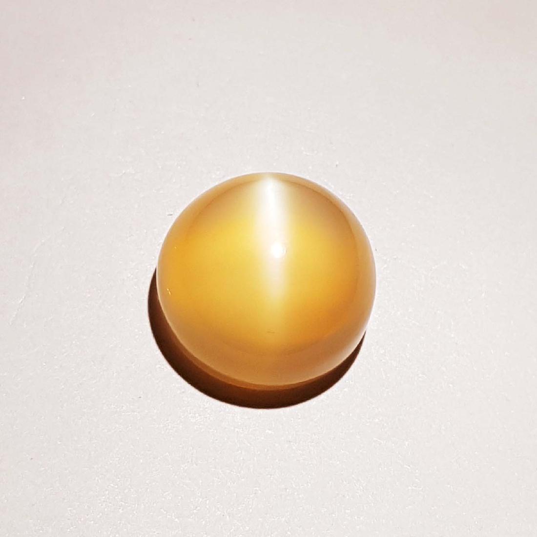 Natural Peach Orange Moonstone Cat's Eye - 14.28 ct: Item: Natural Peach Orange Moonstone Cat's Eye - 14.28 ct Color/Clarity: VVS Loose gemstone Carat Weight: 14.28 Size (mm): 14.50 x 14.30 x 9.10 Round - India No Reserve: This lot starts at $1 and has