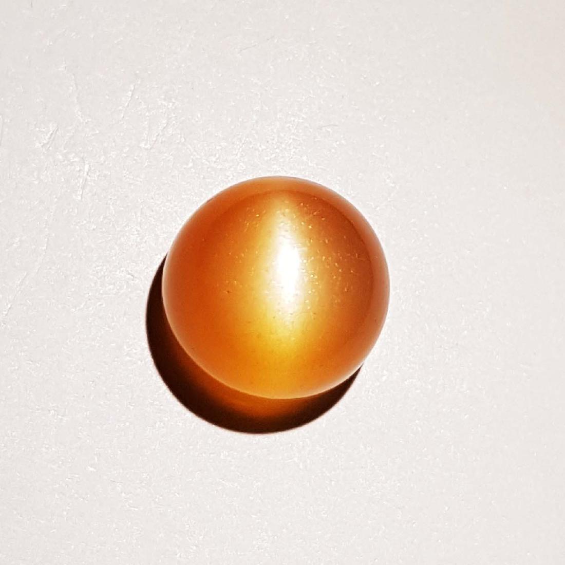 Natural Orange Moonstone Cat's Eye - 10.83 ct: Item: Natural Orange Moonstone Cat's Eye - 10.83 ct Color/Clarity: VVS Loose gemstone Carat Weight: 10.83 Size (mm): 12.30 x 12.30 x 9.25 Round - India No Reserve: This lot starts at $1 and has no res