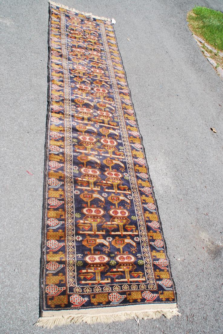 Tribal War Rug Hand Knotted Well Woven Motif: Rare Tribal War rug Hand knotted with well woven motif, nice thick pile and colors 10'x2'6" 2000's wool Please note that this lot has a confidential reserve. When you leave a bid in advance of the auc