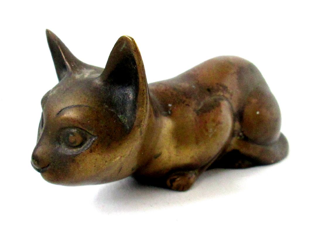 Reclining Siamese Cat: Reclining Siamese Cat C 1900-20 / Brass / 2 3/4"H X 6 3/4"W X 2 5/8"D / Great natural age darkened patina, graphic alert pose, fine heavy hollow casting. / Excellent untouched original condition. Plea