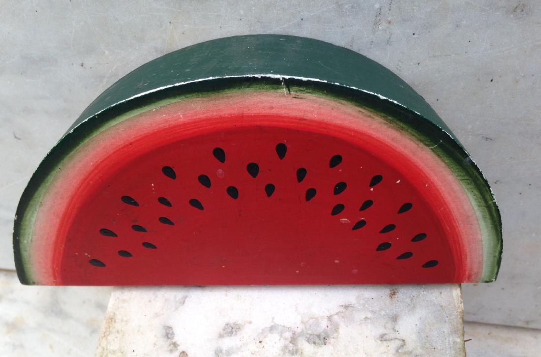 20th C Wooden Store Display Watermelon Wedge: 20thc wooden store display watermelon wedge in GC. 8" long x 4" high. 2" thick. Please note that this lot has a confidential reserve. When you leave a bid in advance of the auction, submit your maximu