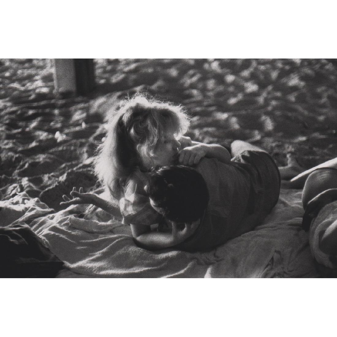 BRUCE DAVIDSON - Young Couple on the Beach: Artist: BRUCE DAVIDSON Print Title: Young Couple on the Beach Medium: Sheet-fed Gravure Printing Date: 1990's Printed in Japan Image Size approx: 8 x 5.5 inches Bruce Davidson (b. 1933) is an American