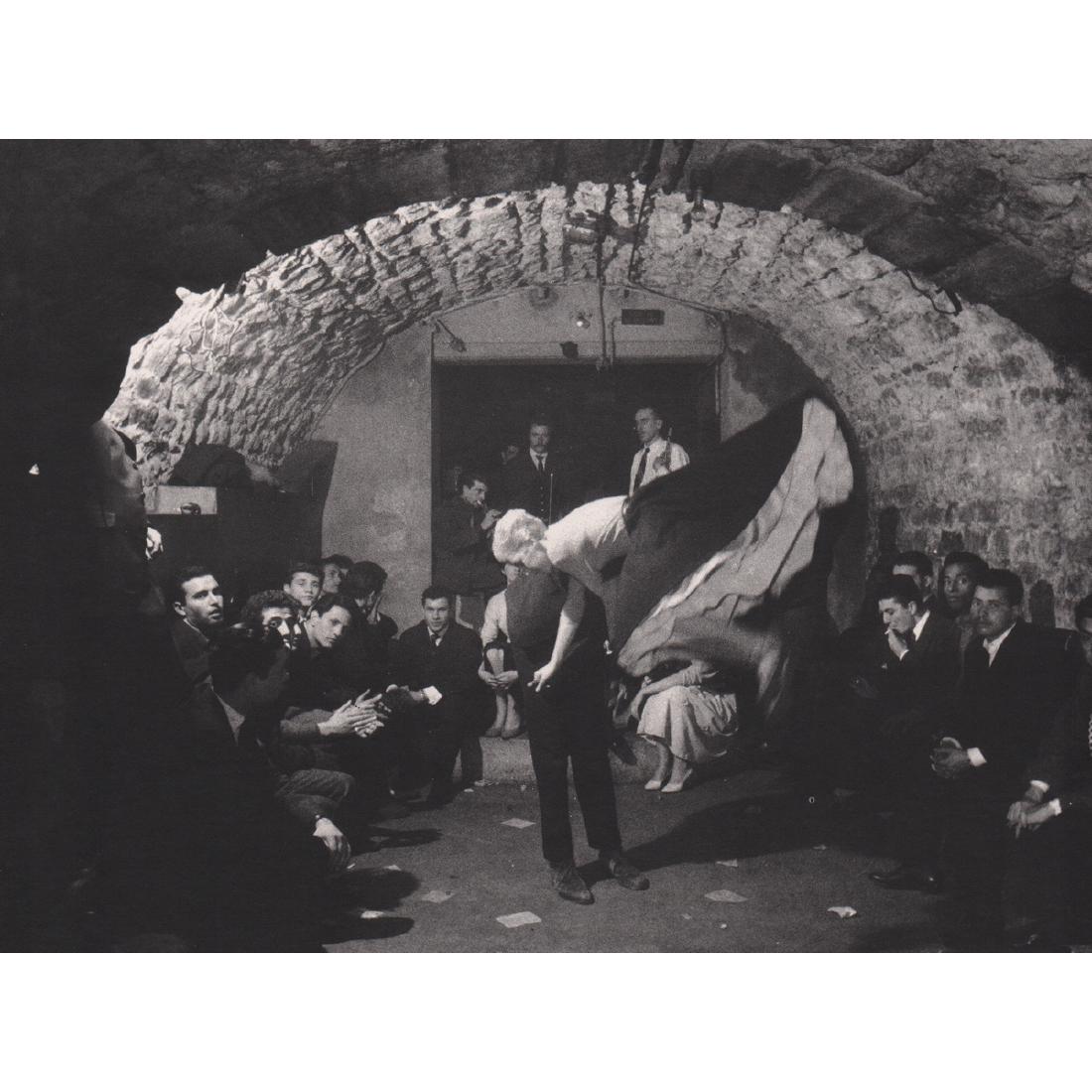 WILLY RONIS - In a Wine Cellar: Artist: WILLY RONIS Print Title: In a Wine Cellar, Rue de la Huchette, 1957 Medium: Photo-lithograph Printing Date: 1980's Printed in France Image Size approx: 7.75 X 5.75 inches Willy Ronis (1910-200