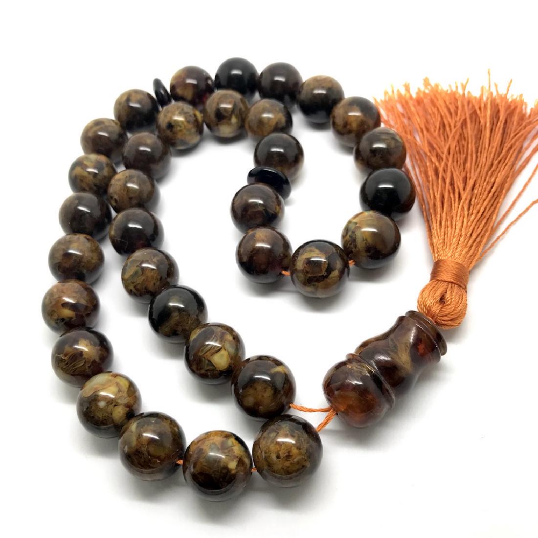 Baltic amber musbaha tesbih Islam rosary 33 beads 50.7: Item: Baltic amber musbaha tesbih Islam rosary 33 beads 50.7 gr marble Gemstones: Baltic amber Weight: 50.7 gr Size: ø13.5mm Additional Information: colour: dark marble butterscotch Please note that 