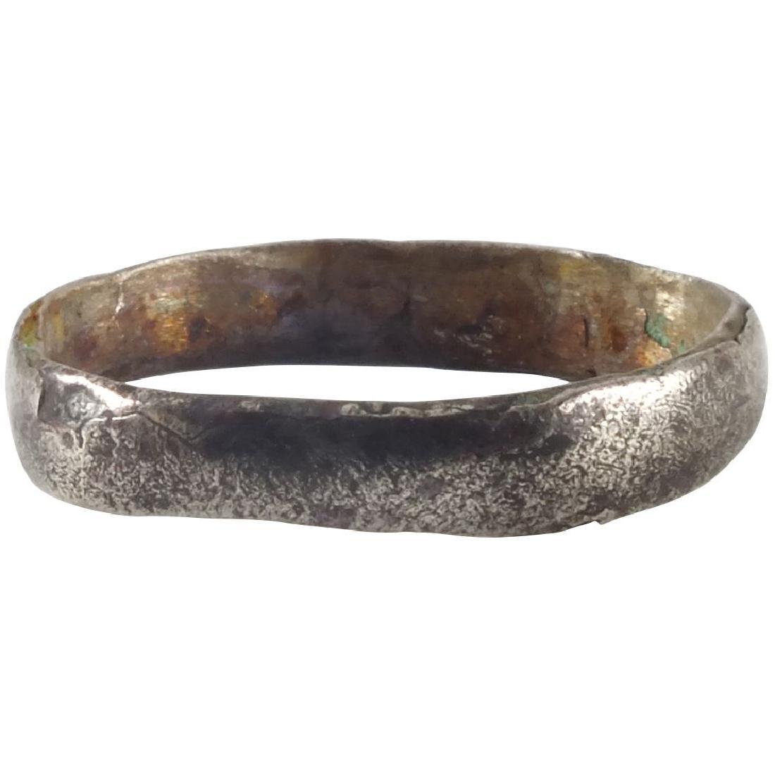 VIKING WOMAN’S WEDDING RING, 866-1067 AD: Silver, size 4 1/4. Medium width band of low rounded section. Good patina. Vikings exchanged rings on the pommel of the groom’s sword. No Reserve: This lot starts at $1 and has no reserve as a court