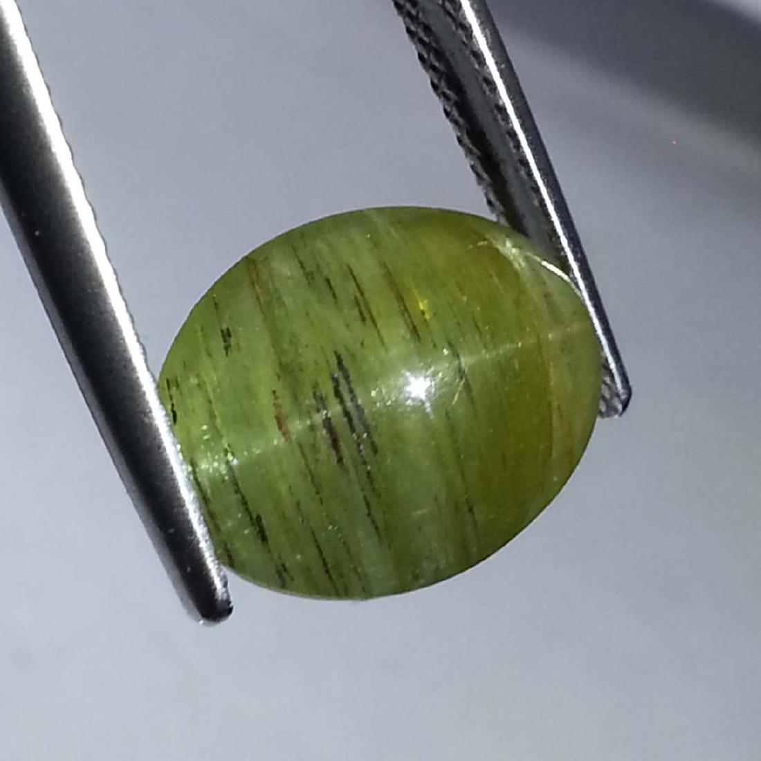 Top Quality Natural Apatite cat's Eye - 7.67 ct: Item: Top Quality Natural Apatite cat's Eye - 7.67 ct Color/Clarity: Opaque Loose gemstone Carat Weight: 7.67 Size (mm): 13.20 x 10.50 x 6.55 Oval - Africa No Reserve: This lot starts at $1 and has no