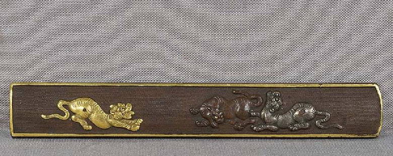 19c Japanese sword fitting KOZUKA TIGERS playing: Early 19th century Japanese sword kozuka (sword knife) handle with three playful tigers in different attitudes on punched ground. Excellent design, crisp detailing, each tiger is done in different