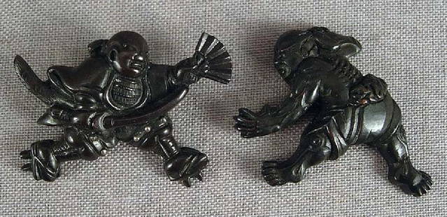 Pair 19c sword shakudo MENUKI Yoshitsune & Benkei: Pair of early 19th century Japanese sword menuki depicting young Yoshitsune and Benkei at the Gojo bridge in Kyoto. For an account of this significant encounter see H. Joly LEGEND IN JAPANESE ART, p.